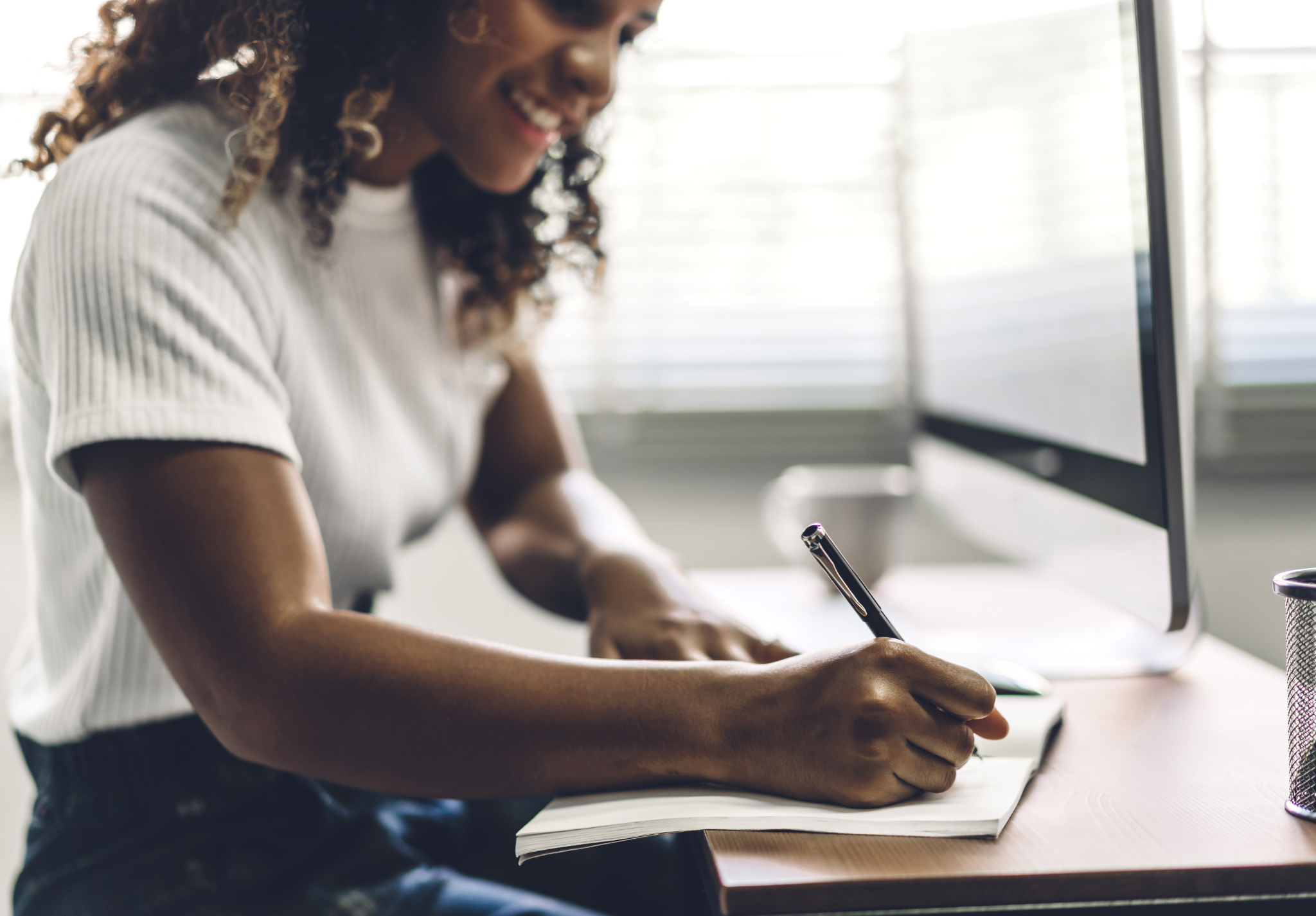 Woman on laptop recovering from mental health crisis