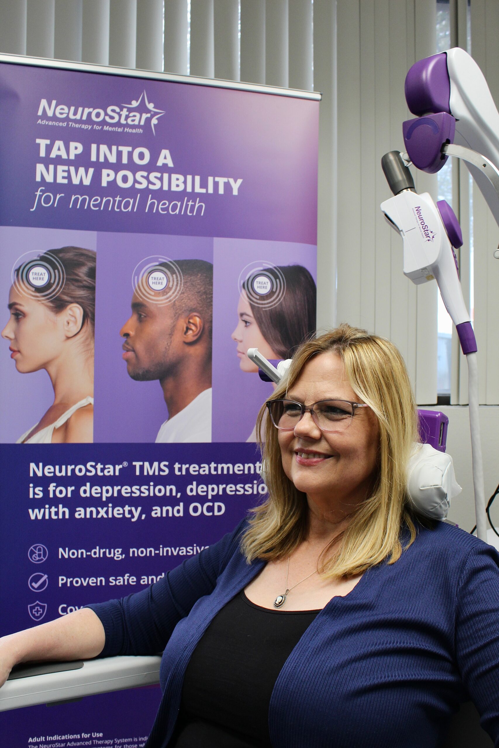 Patient seated and receiving TMS therapy at DreamWork Wellness Center, with the NeuroStar device positioned over their head in a calm, professional treatment room.